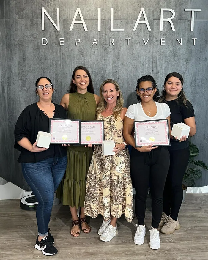 Nailspiracy Academy graduates holding Russian Manicure course certificates at Nail Art Department