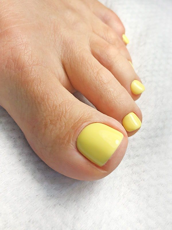 Yellow gel pedicure at Nail Art Department